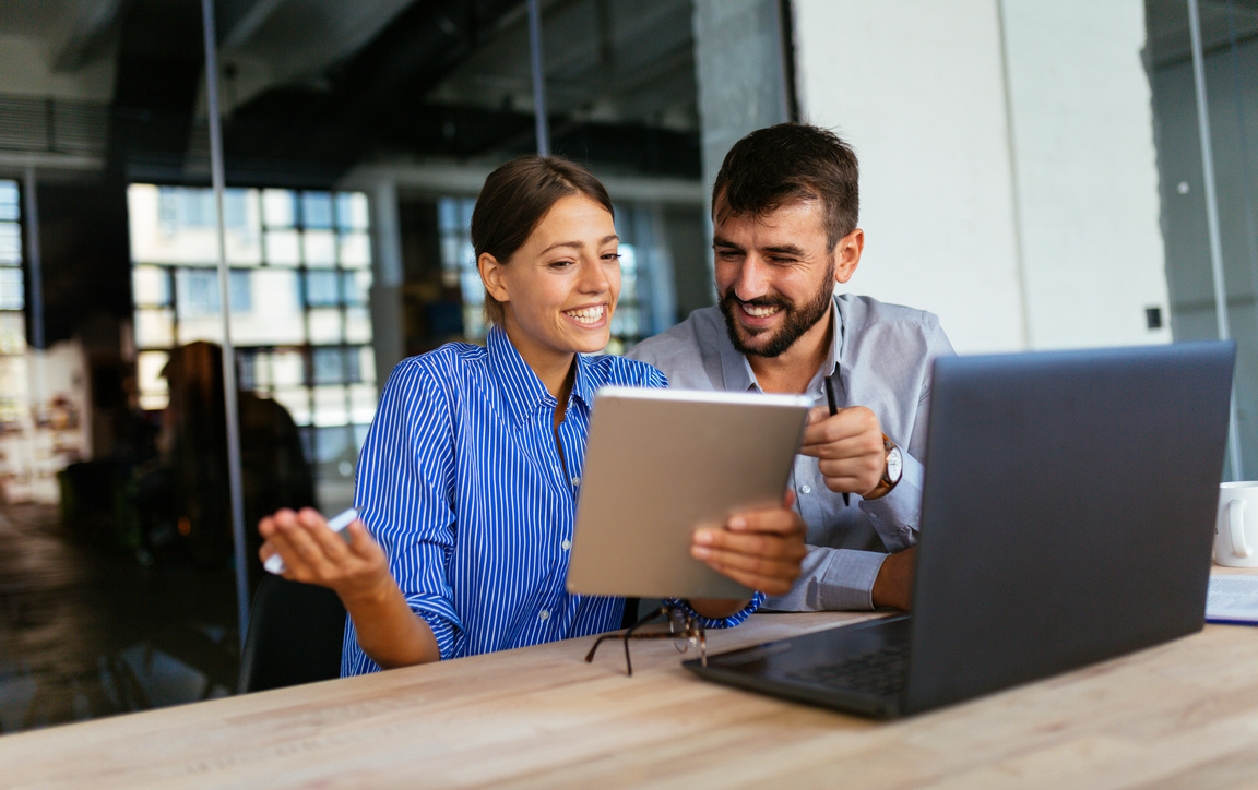 Two people working together at office